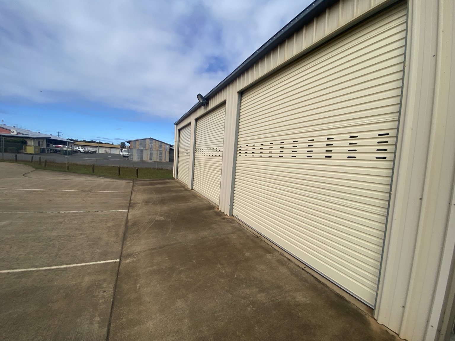 Row of commercial cream roller doors